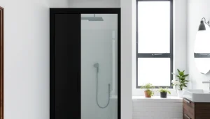 Enhance your bathroom with a stylish black shower sliding door featuring sleek glass and striking black frame.